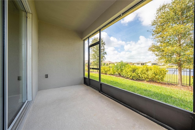 unfurnished sunroom featuring a residential view