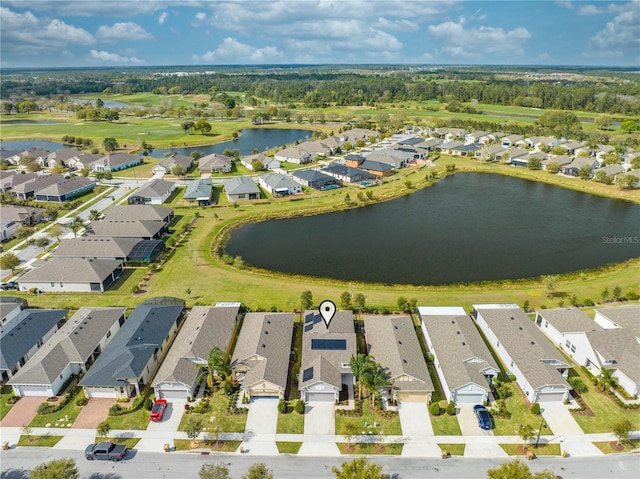 aerial view with a residential view and a water view