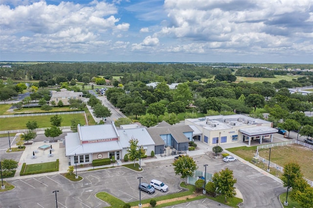 drone / aerial view with a wooded view