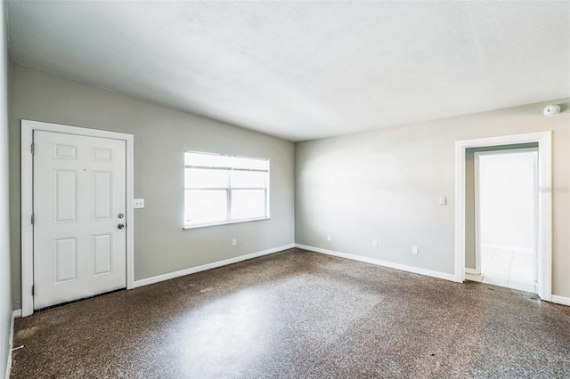 empty room with baseboards