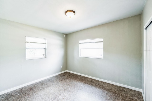 spare room featuring baseboards