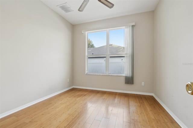 empty room with ceiling fan, visible vents, baseboards, and light wood-style flooring