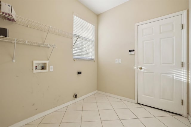 washroom with baseboards, light tile patterned floors, laundry area, hookup for a washing machine, and electric dryer hookup