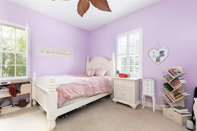 2161 Snow Rd, Orlando, FL 32814 - bedroom featuring light carpet, a ceiling fan, and multiple windows