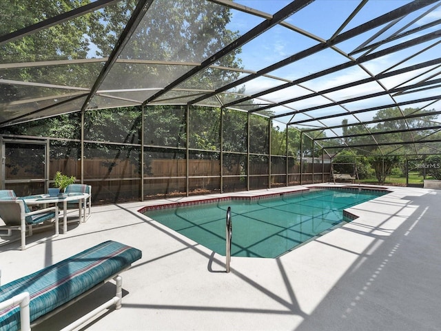 view of pool featuring a fenced in pool, a patio area, a fenced backyard, and a lanai