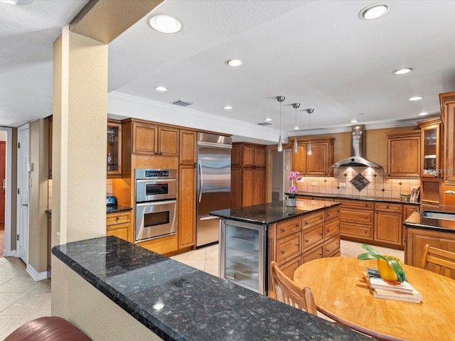 kitchen with wine cooler, light tile patterned flooring, visible vents, wall chimney range hood, and appliances with stainless steel finishes