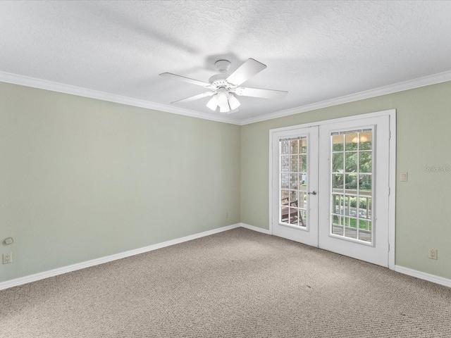 carpeted empty room with ornamental molding, french doors, a textured ceiling, and a ceiling fan