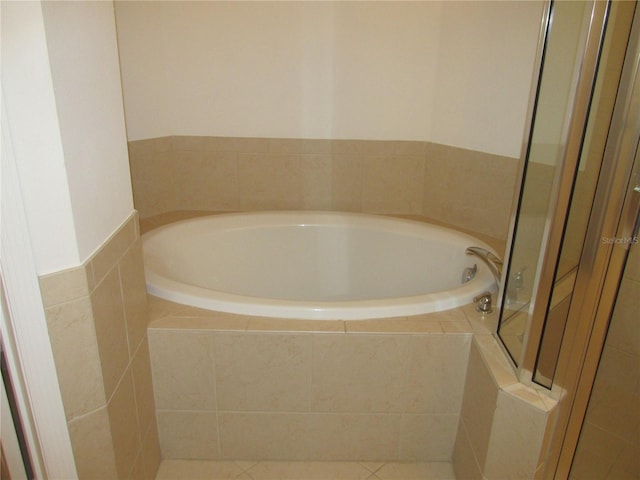 full bathroom featuring a garden tub