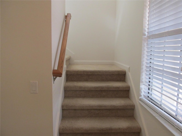 stairs featuring baseboards