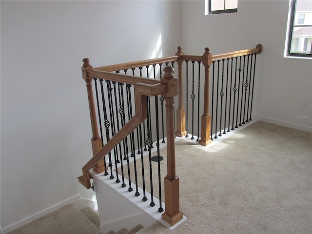 stairs with carpet and baseboards