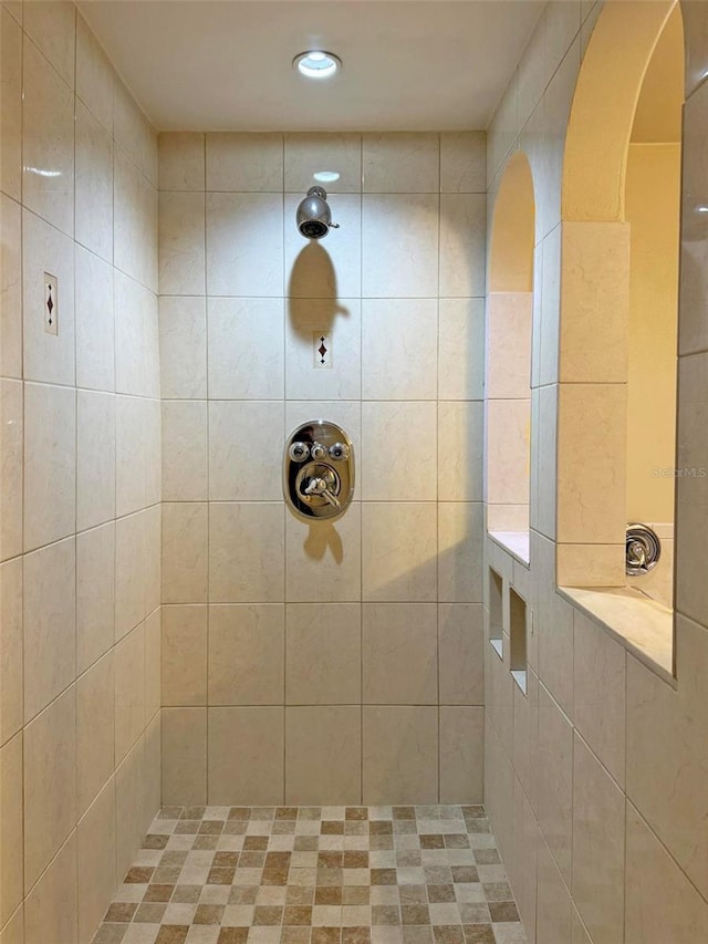 bathroom with tiled shower