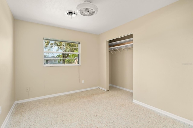 unfurnished bedroom featuring a closet, visible vents, and baseboards