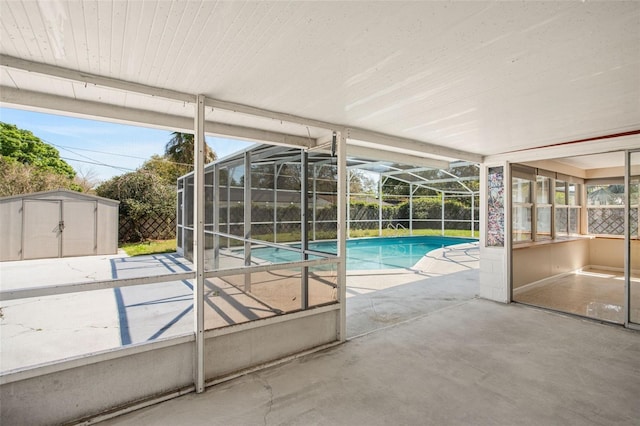 view of pool with a fenced in pool, a storage shed, a patio area, a lanai, and an outdoor structure