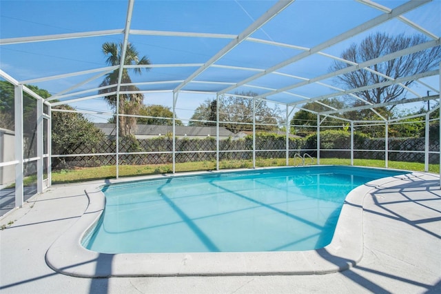 view of pool featuring a lanai, a patio area, a fenced backyard, and a fenced in pool