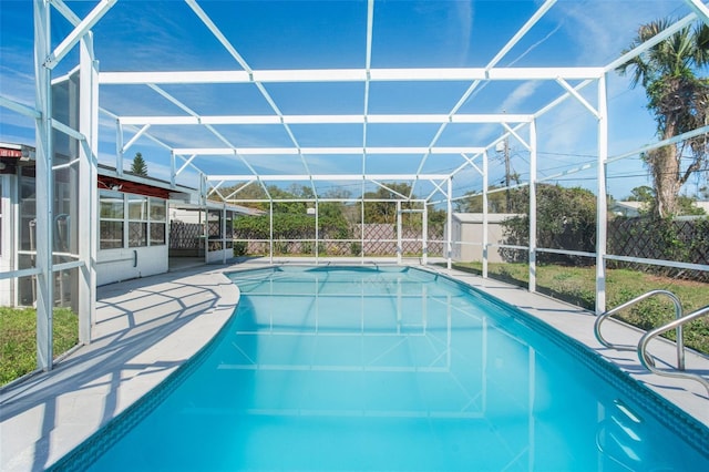 view of pool featuring a patio, a lanai, a fenced in pool, and fence