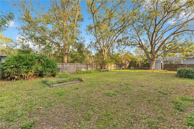 view of yard with a fenced backyard