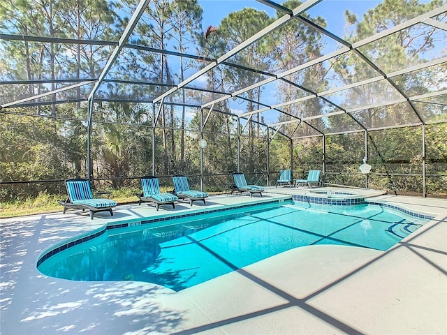 view of swimming pool with a lanai, a patio area, and a pool with connected hot tub