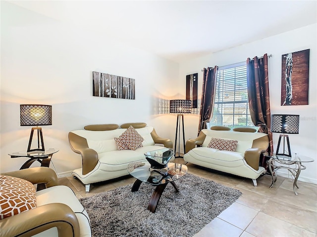 tiled living area featuring baseboards