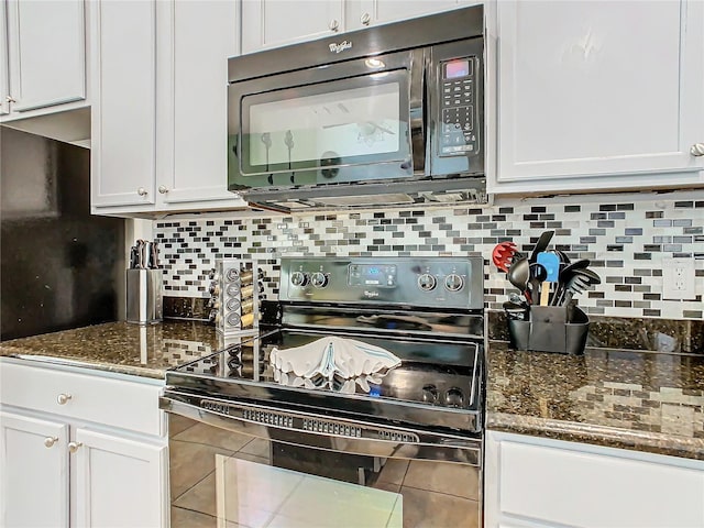 kitchen with decorative backsplash, white cabinetry, and black appliances