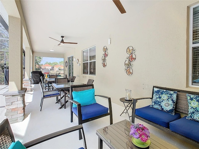 sunroom with a ceiling fan