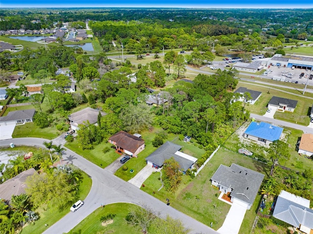 birds eye view of property with a residential view