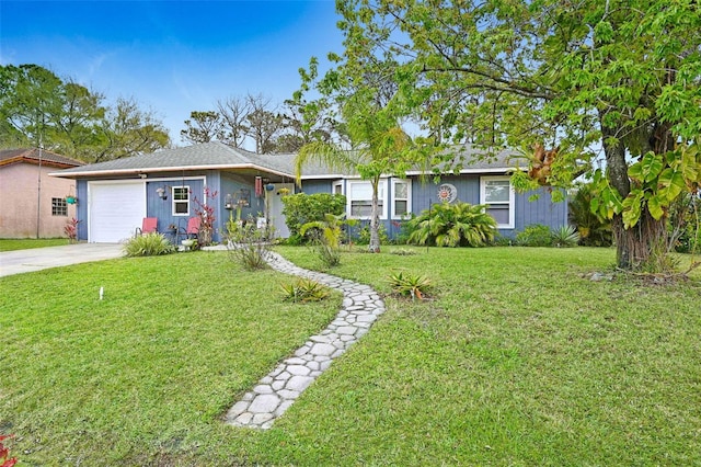 ranch-style house with a front lawn, driveway, and an attached garage