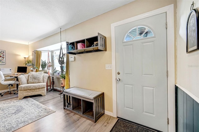 foyer featuring light wood-style floors