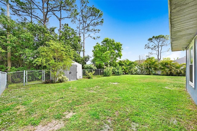 view of yard featuring a fenced backyard, an outdoor structure, and a storage shed