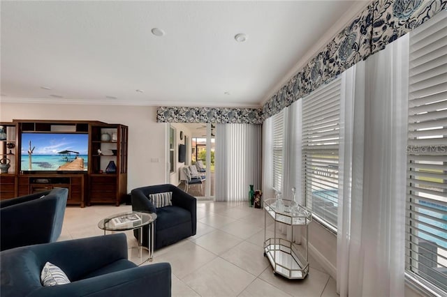 living area featuring ornamental molding and light tile patterned floors