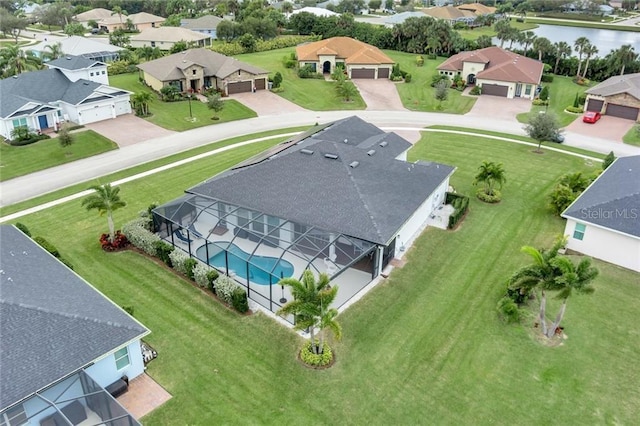 aerial view with a water view and a residential view