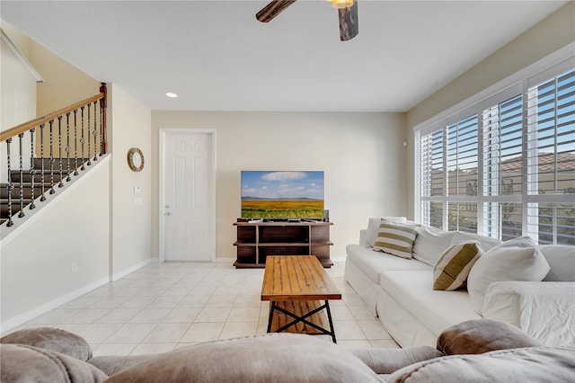 tiled living area with baseboards, stairway, a ceiling fan, and recessed lighting