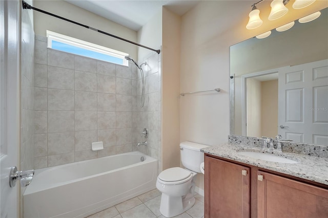 full bath featuring toilet, tile patterned flooring, vanity, and bathing tub / shower combination