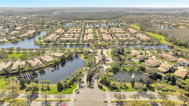 birds eye view of property featuring a water view and a residential view