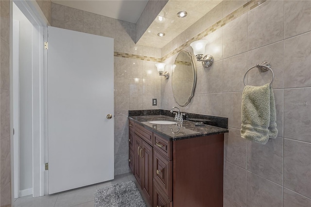 bathroom featuring vanity, tile walls, and tile patterned floors