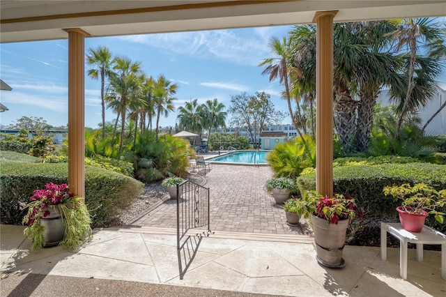 view of swimming pool with a fenced in pool and a patio