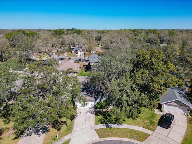 aerial view with a residential view and a view of trees