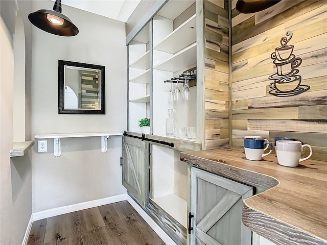 bathroom featuring baseboards and wood finished floors