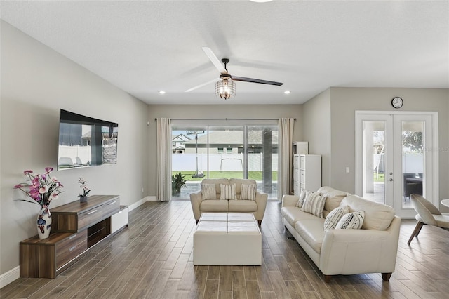 living area featuring french doors, wood finished floors, and a wealth of natural light