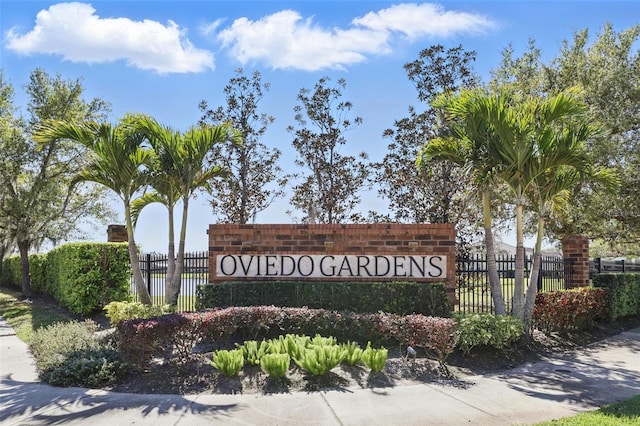 community sign with fence