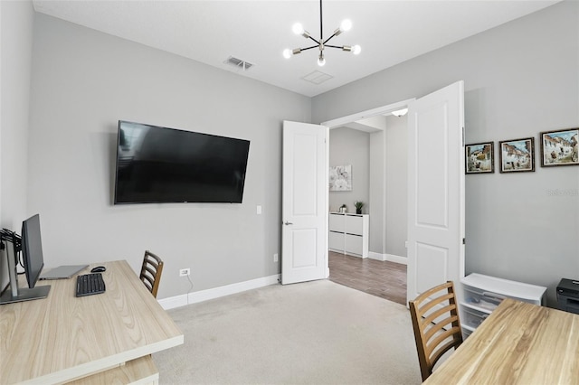 carpeted office featuring visible vents, baseboards, and a notable chandelier