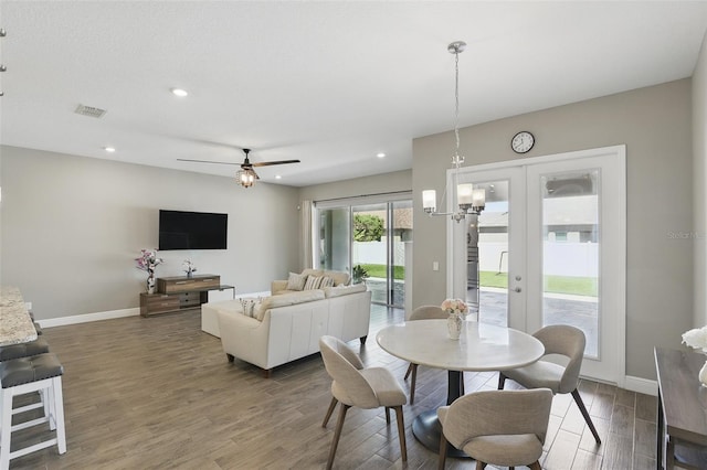 dining area featuring recessed lighting, wood finished floors, baseboards, and french doors