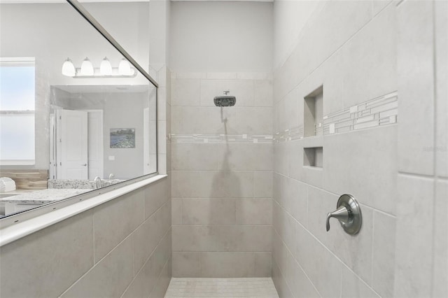 full bathroom featuring tiled shower