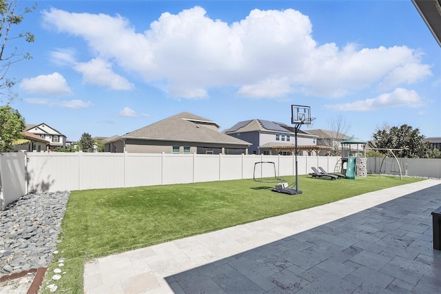 view of patio / terrace featuring a playground and a fenced backyard