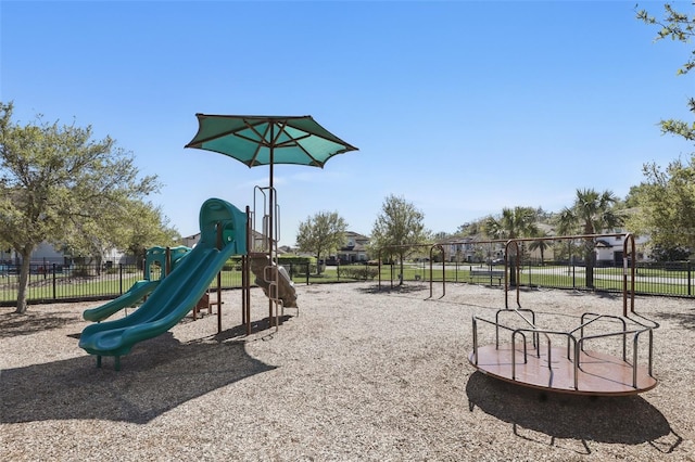 communal playground featuring fence