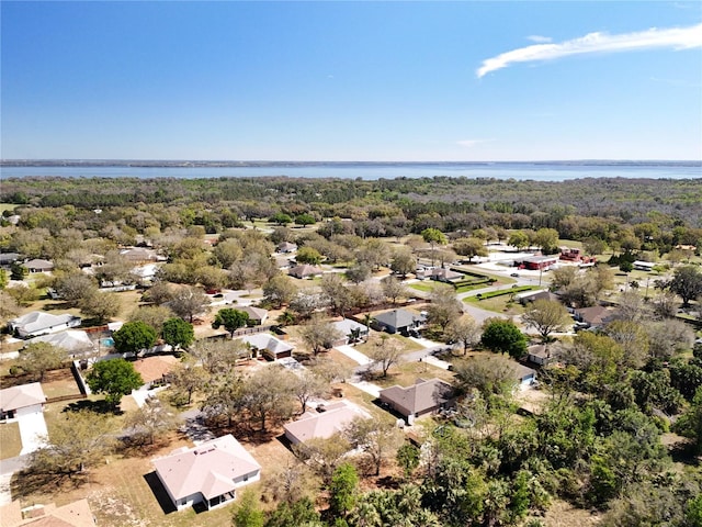 bird's eye view featuring a residential view and a water view