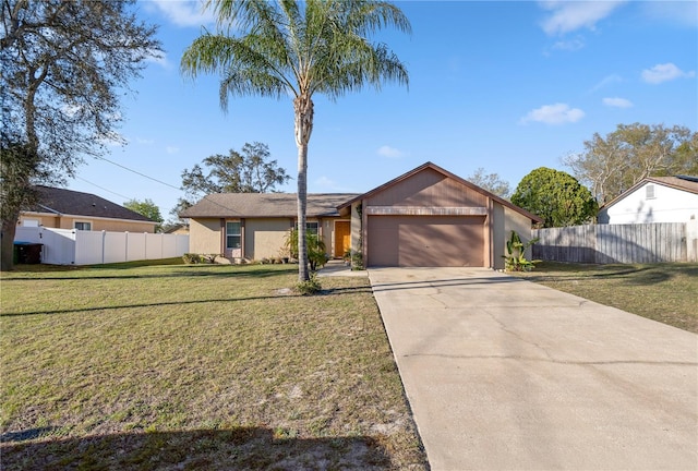 mid-century modern home featuring a garage, driveway, a front yard, and fence