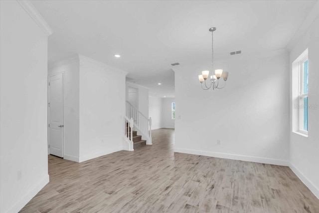 1067 Signet, Apollo Beach, FL 33572 - spare room with a chandelier, stairs, light wood-style floors, recessed lighting, and baseboards