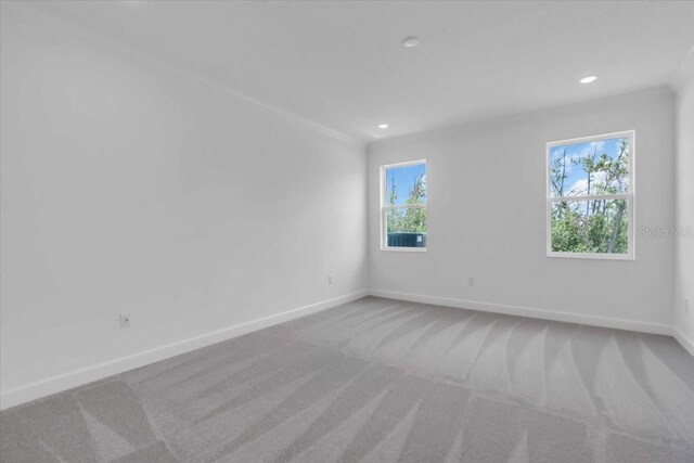 1067 Signet, Apollo Beach, FL 33572 - carpeted empty room with baseboards and recessed lighting