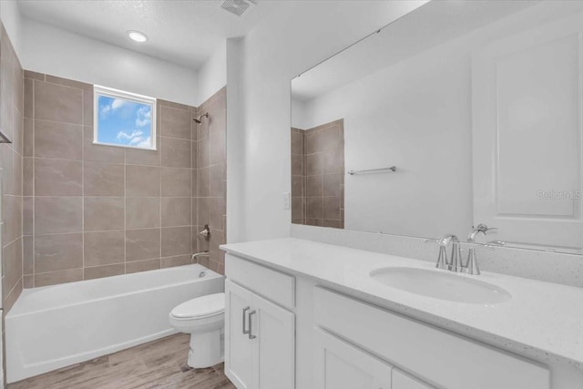 1067 Signet, Apollo Beach, FL 33572 - full bathroom with  shower combination, wood finished floors, toilet, and vanity