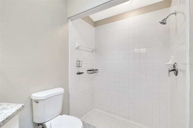 full bathroom featuring toilet and tiled shower